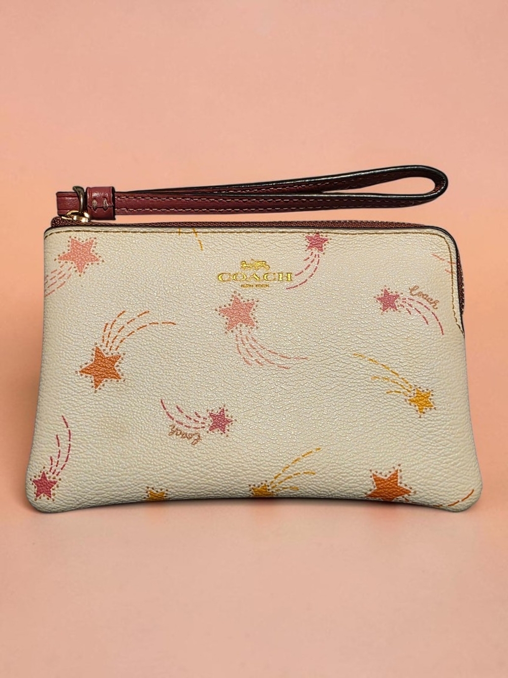 Coach Cream Wristlet with Pink & Orange Shooting Star Print-EUC